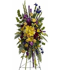 Tall standing floral spray with yellow and purple flowers