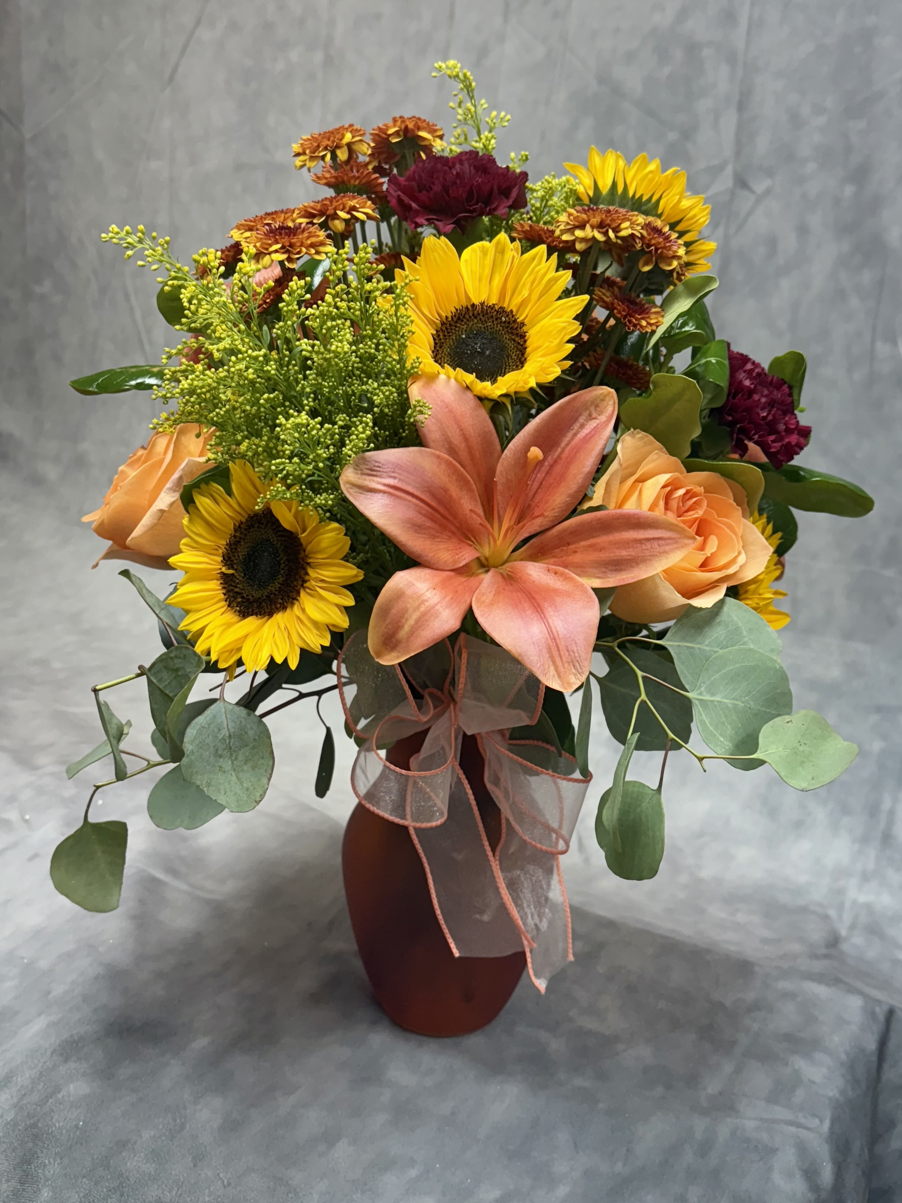 A Touch of Fall - Embrace the beauty of fall with our exquisite fall arrangement!  Handcrafted with vibrant hues of fall colors, our arrangements capture the essence of the season. Perfect centerpiece to brighten someone's day :)