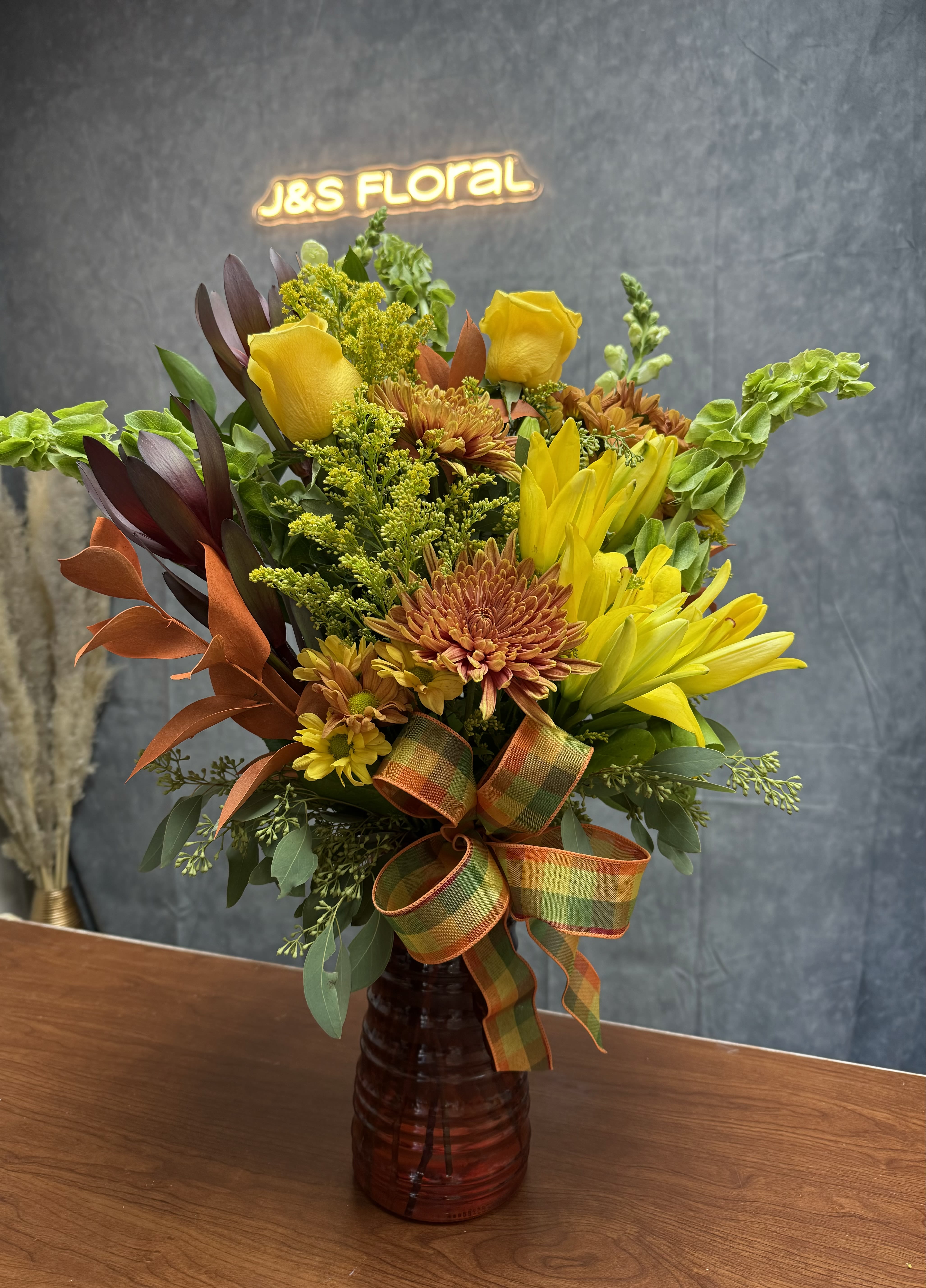 Autumn Blooms - Embrace the beauty of fall with our exquisite Autumn Blooms arrangement!  Handcrafted with vibrant hues of fall colors, our arrangements capture the essence of the season. Perfect centerpiece to brighten someone's day :)