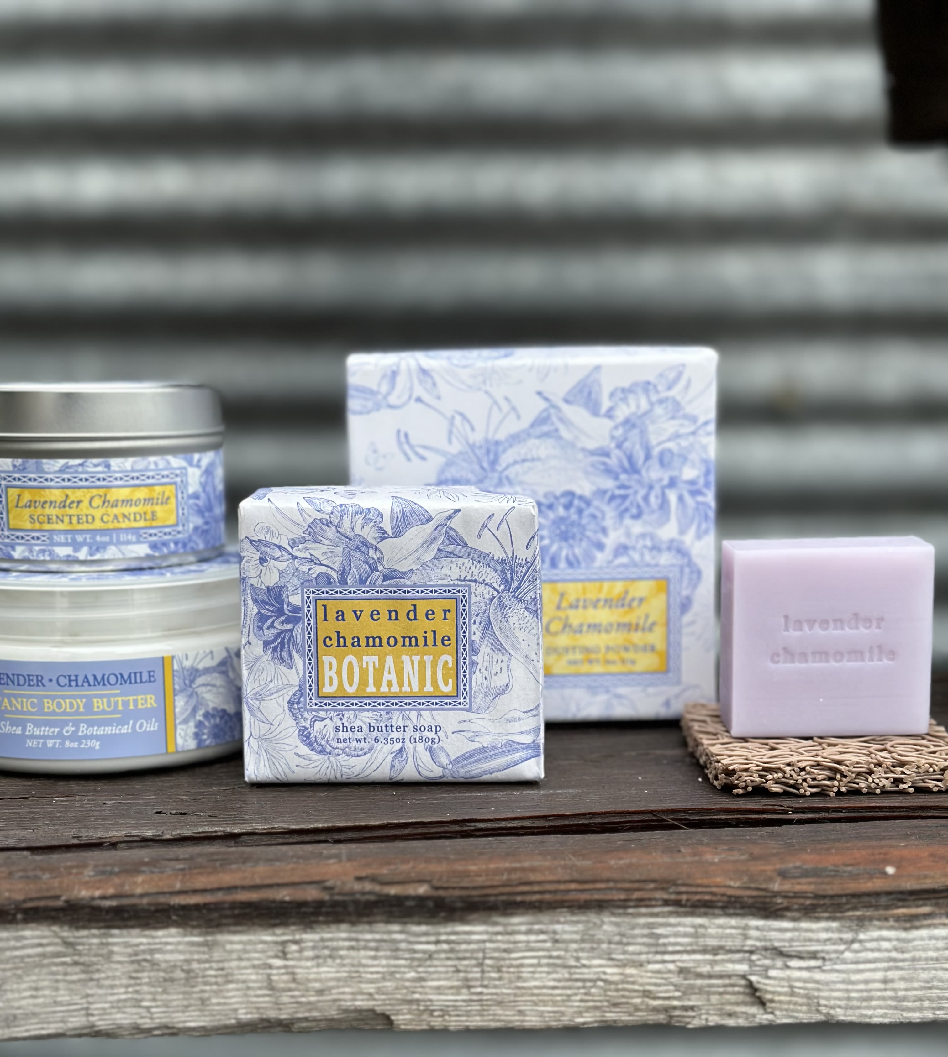 Lavender chamomile scented soap, candle, and body butter products on a shelf