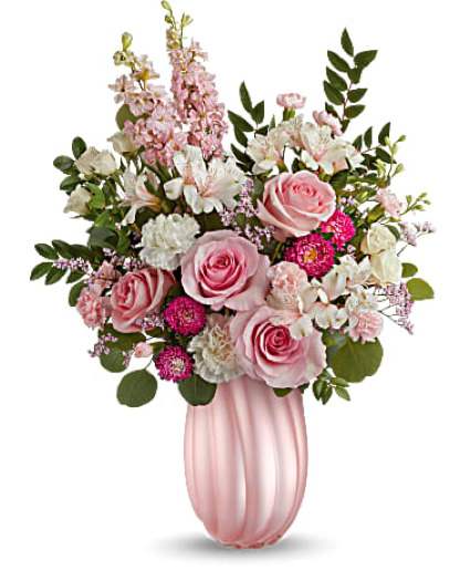 Pink roses and white flowers in a pink vase