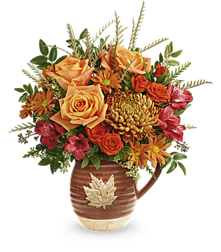 Teleflora's Cascading Blooms - Capture the beauty of cascading fall leaves with this heartwarming rose bouquet in a gorgeous, glazed ceramic pitcher that's food safe for serving. Perfect to decorate your table for Thanksgiving or any special occasion.