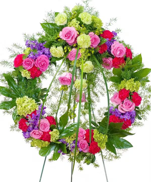 FOREVER CHERISHED WREATH - This beautiful wreath with a combination of pink and purple flowers will show that they will be forever cherished.  
