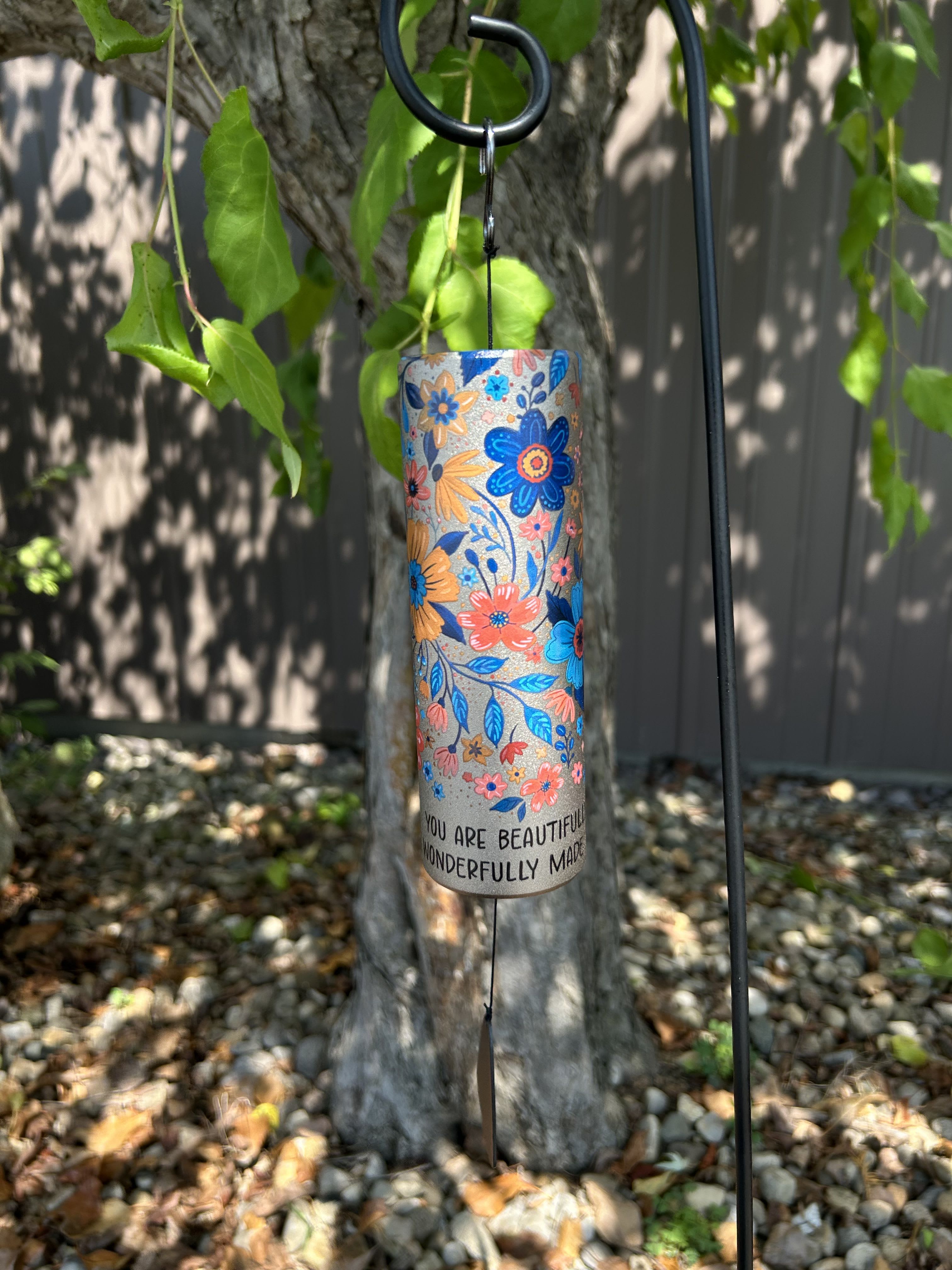 Floral-patterned hanging wind chime with a message