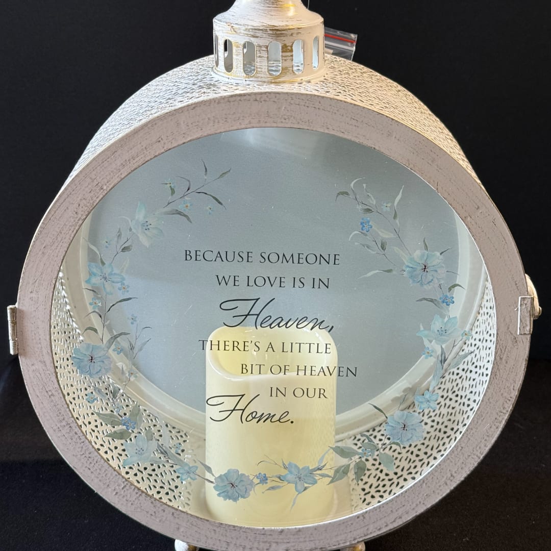 Round memorial lantern with a candle and floral quote insert