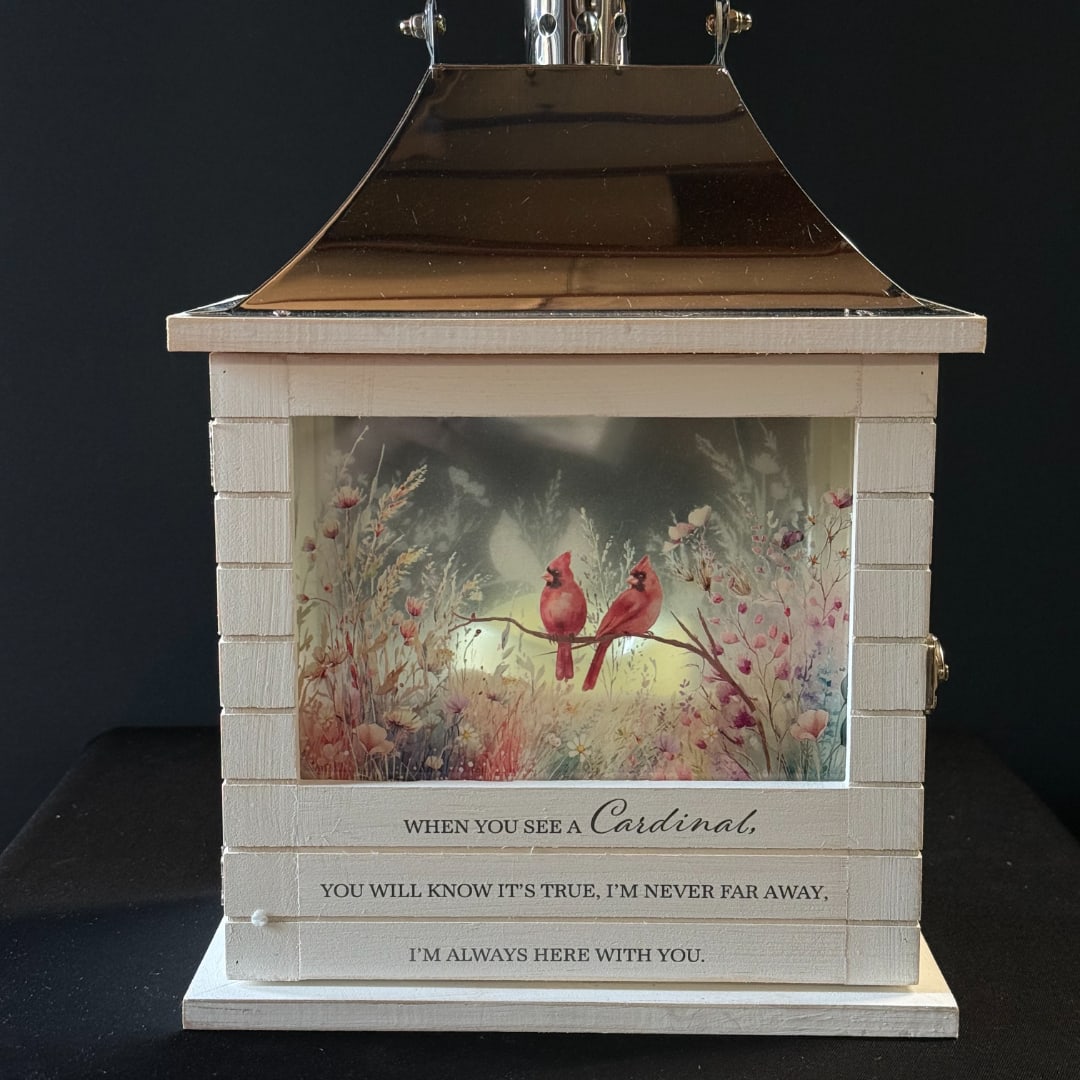 Decorative lantern with a cardinal scene and memorial quote