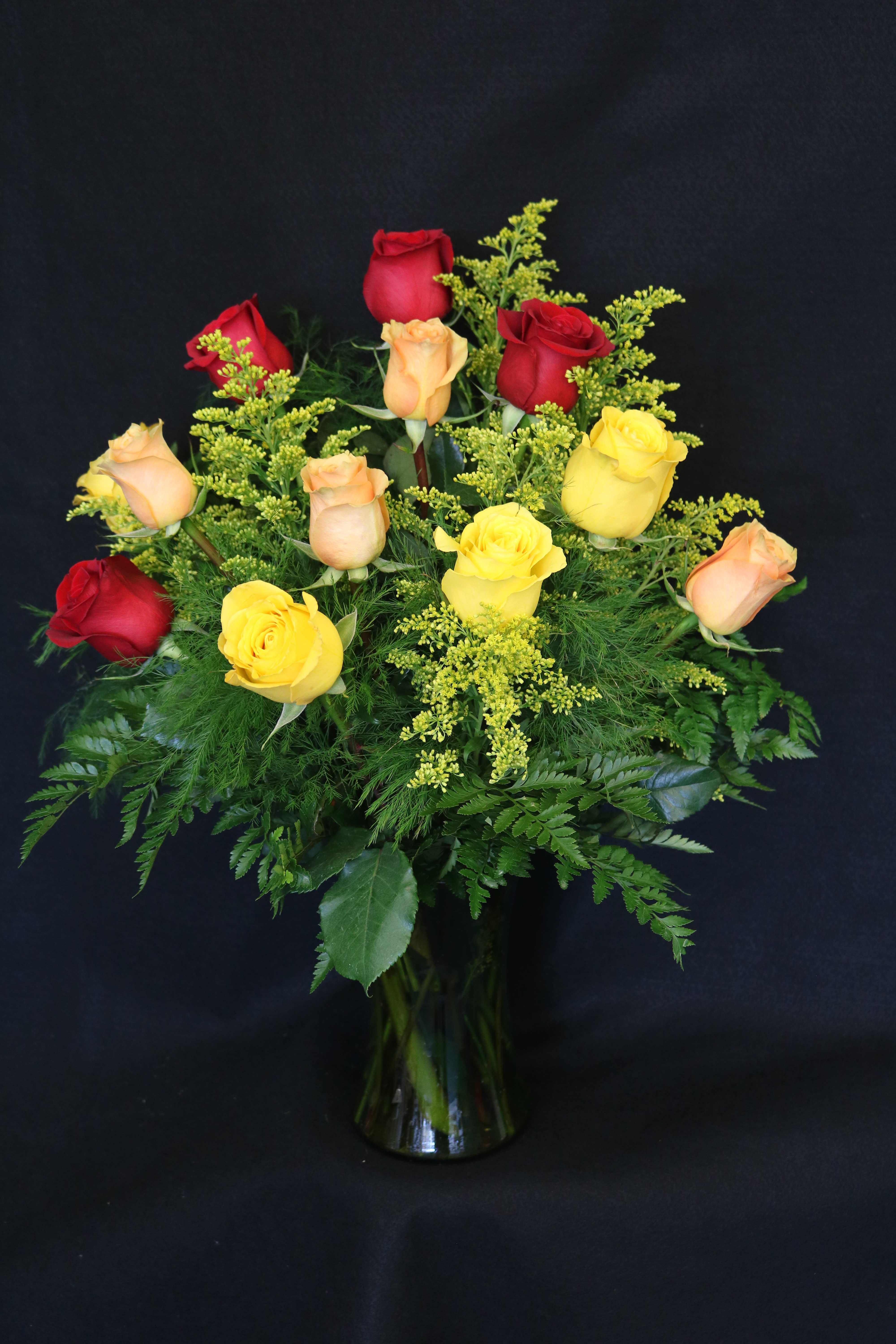 Autumn Roses - A dozen roses in red, yellow, and orange for a fall-inspired arrangement.