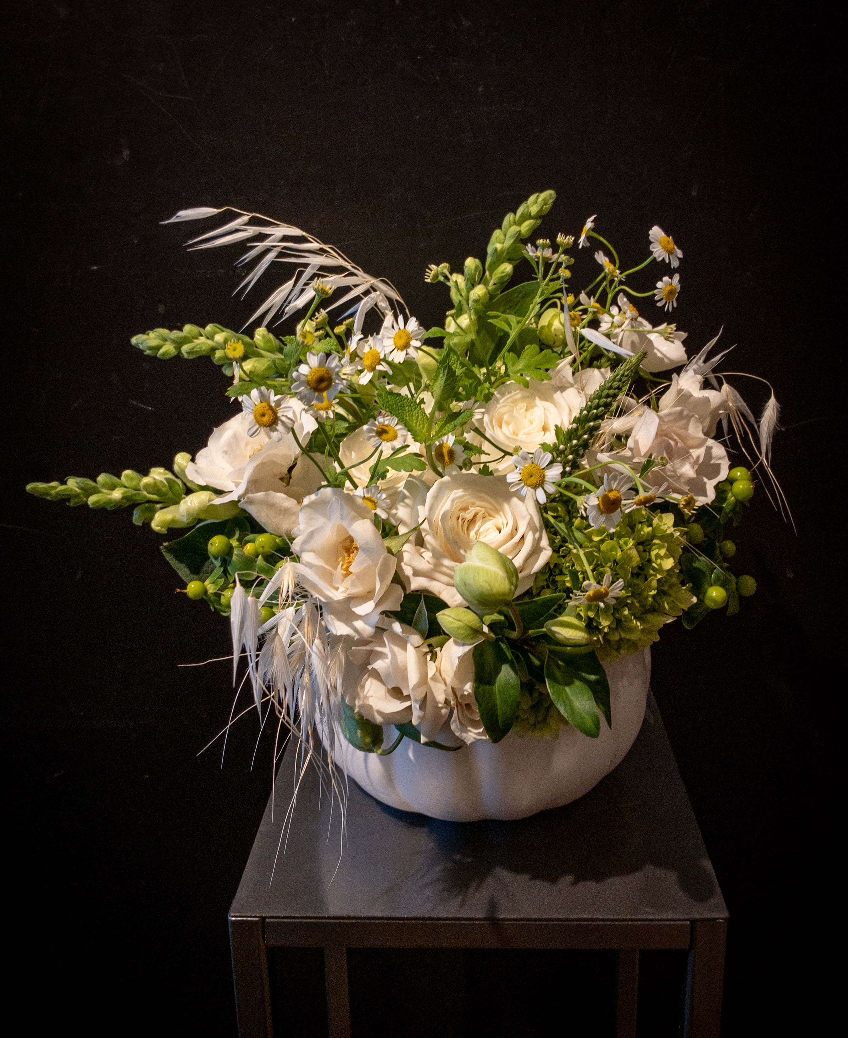Bibbidi-bobbidi-boo! - A lovely ceramic white pumpkin cachepot festooned with white floral lushness!  Creamy white roses, bleached sea oats or pampas grass, and more!  Don your fairy godmother cape and wand or just say the words... and off we'll go sending this creation to your loved one.  Approximately 12x12x12