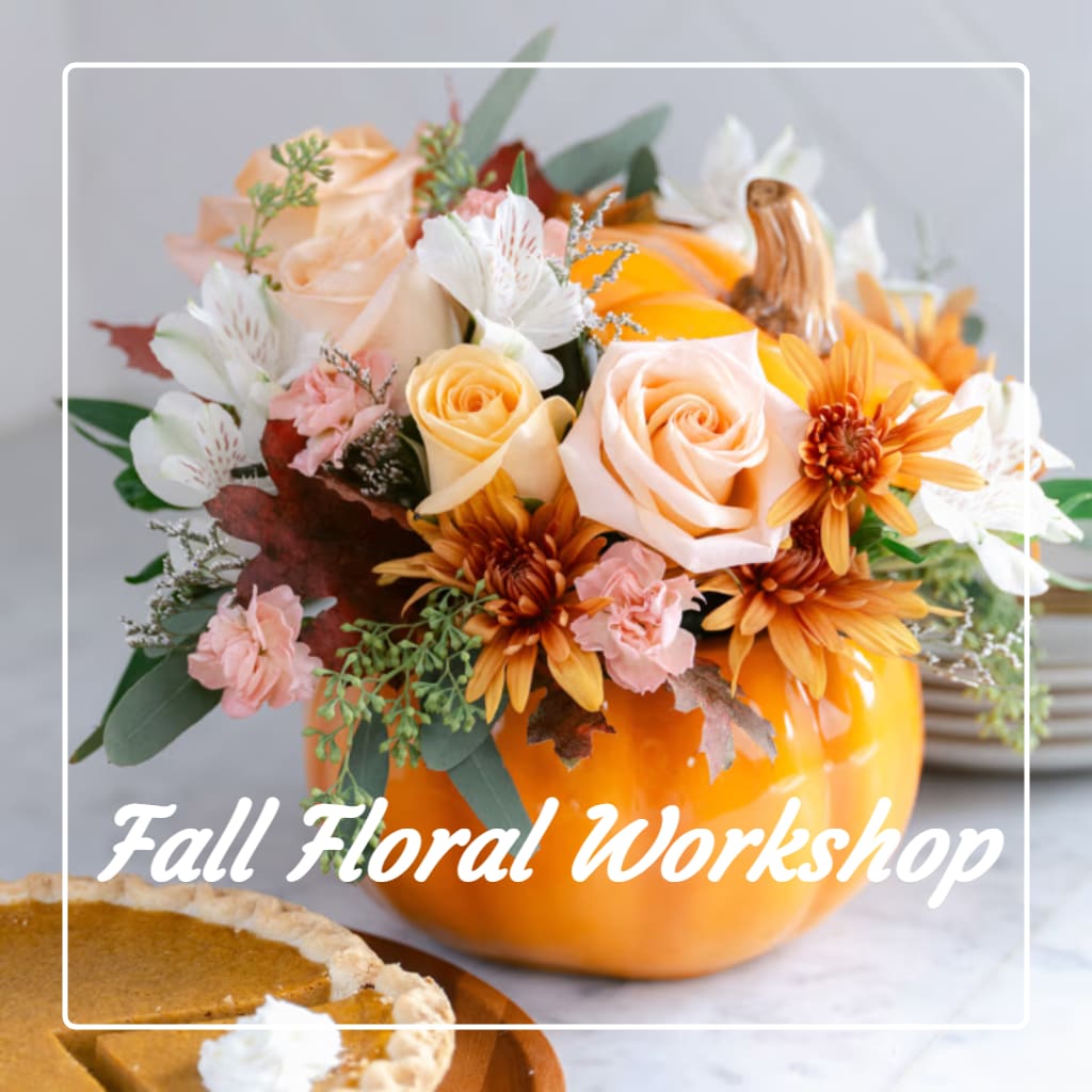 Fall floral arrangement in a pumpkin vase with peach, white, and orange blooms