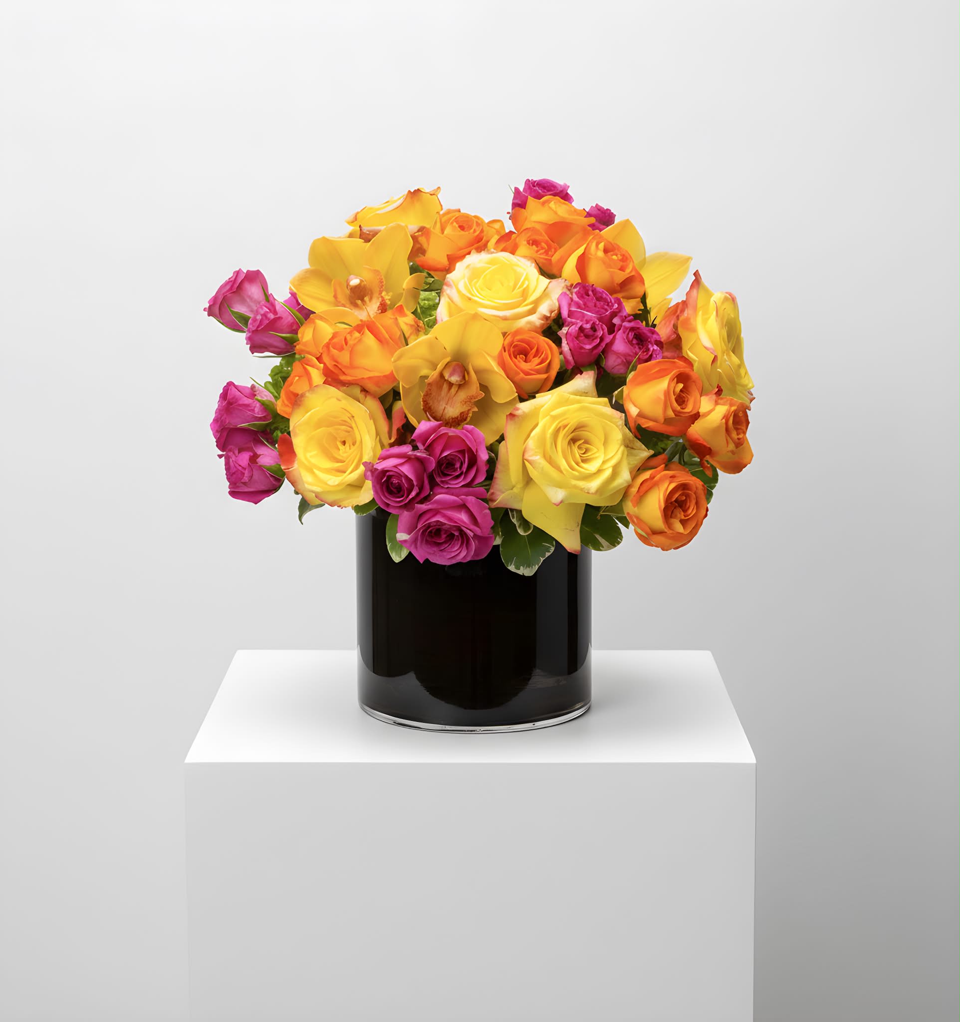 Bright Abundance  - This cylindrical vase of flowers is kind of like a time capsule, if time were made of flowers. What a wonderful “time” that would be. In the season of changing plants, leaves, and flowers, this cylinder of bright abundance reminds us of the beauty that comes with the changing of the seasons. Spoiler alert: that’s a lot of beauty.