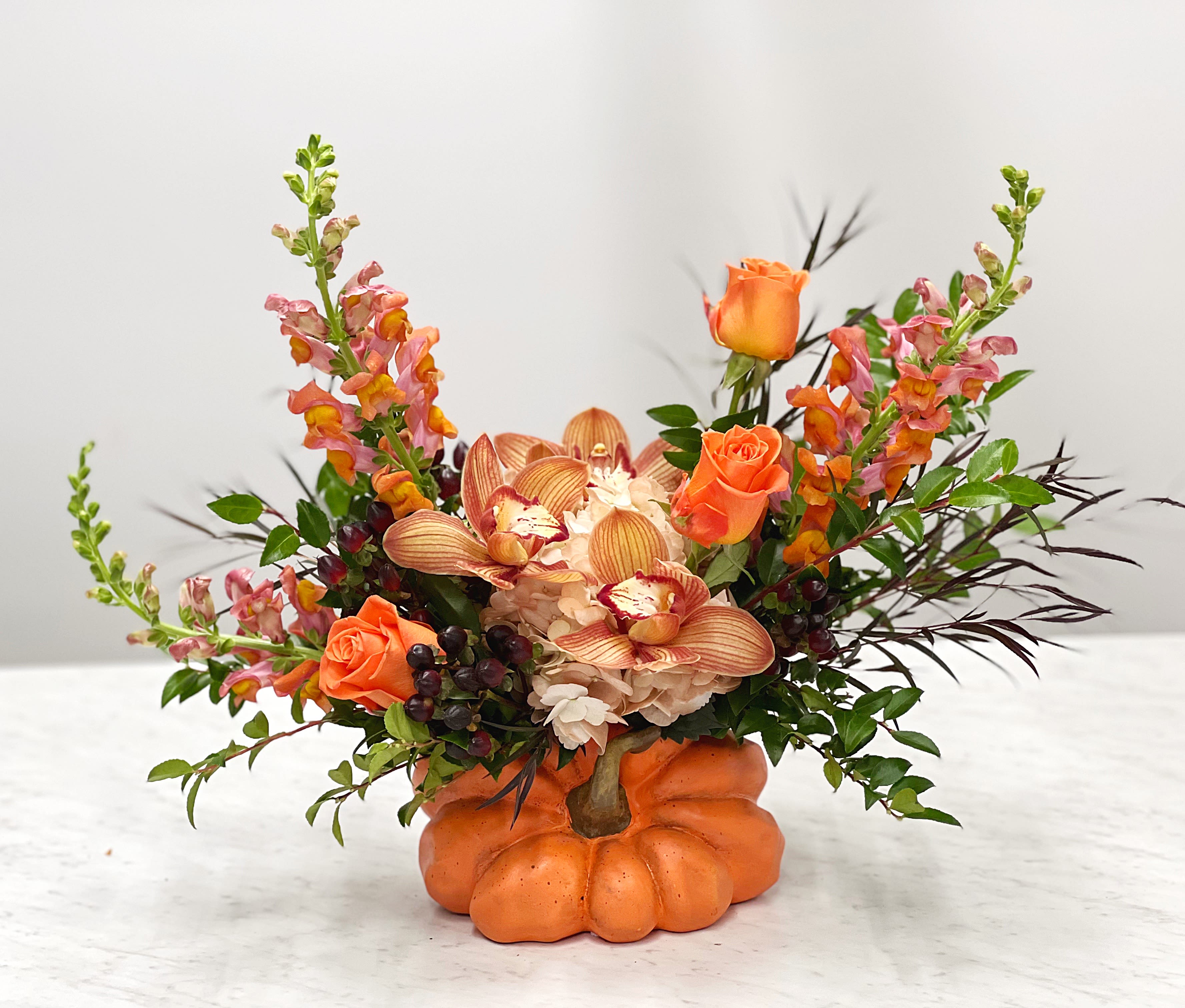 Natures Bounty Pumpkin  - A beautiful fall arrangement in a ceramic fall pumpkin. 