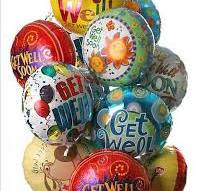 Cluster of colorful printed balloons with birthday messages