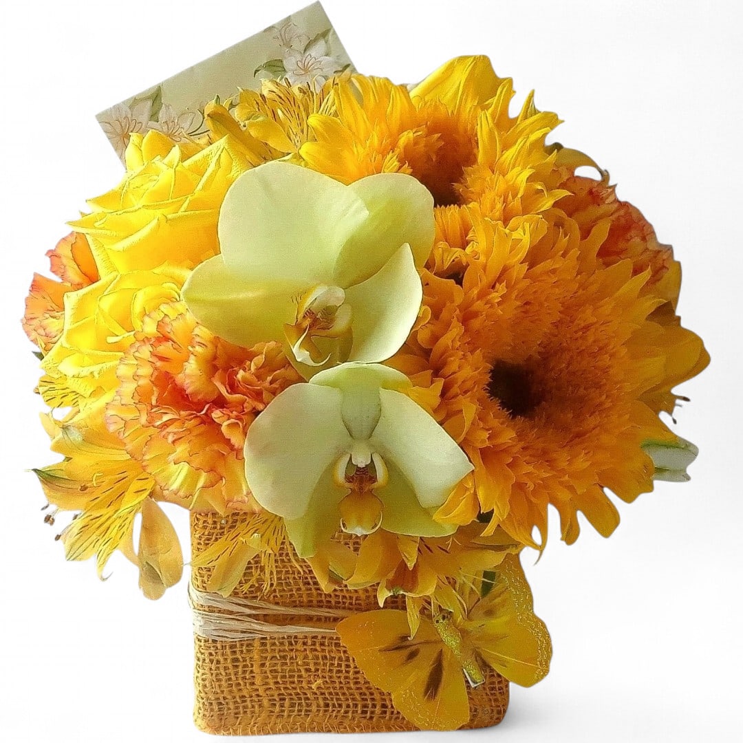 Yellow and orange bouquet with white orchids in a burlap-wrapped container