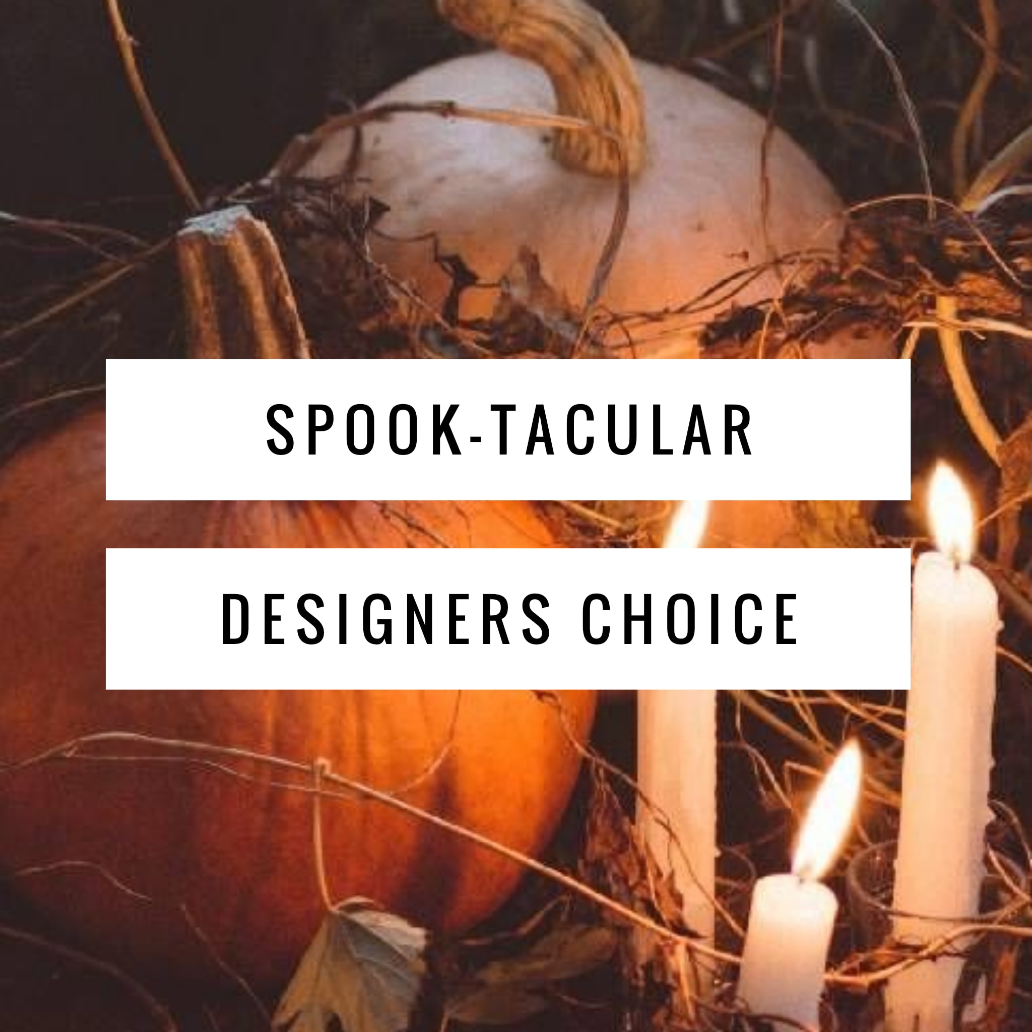 Halloween pumpkins with lit candles and spooky twigs