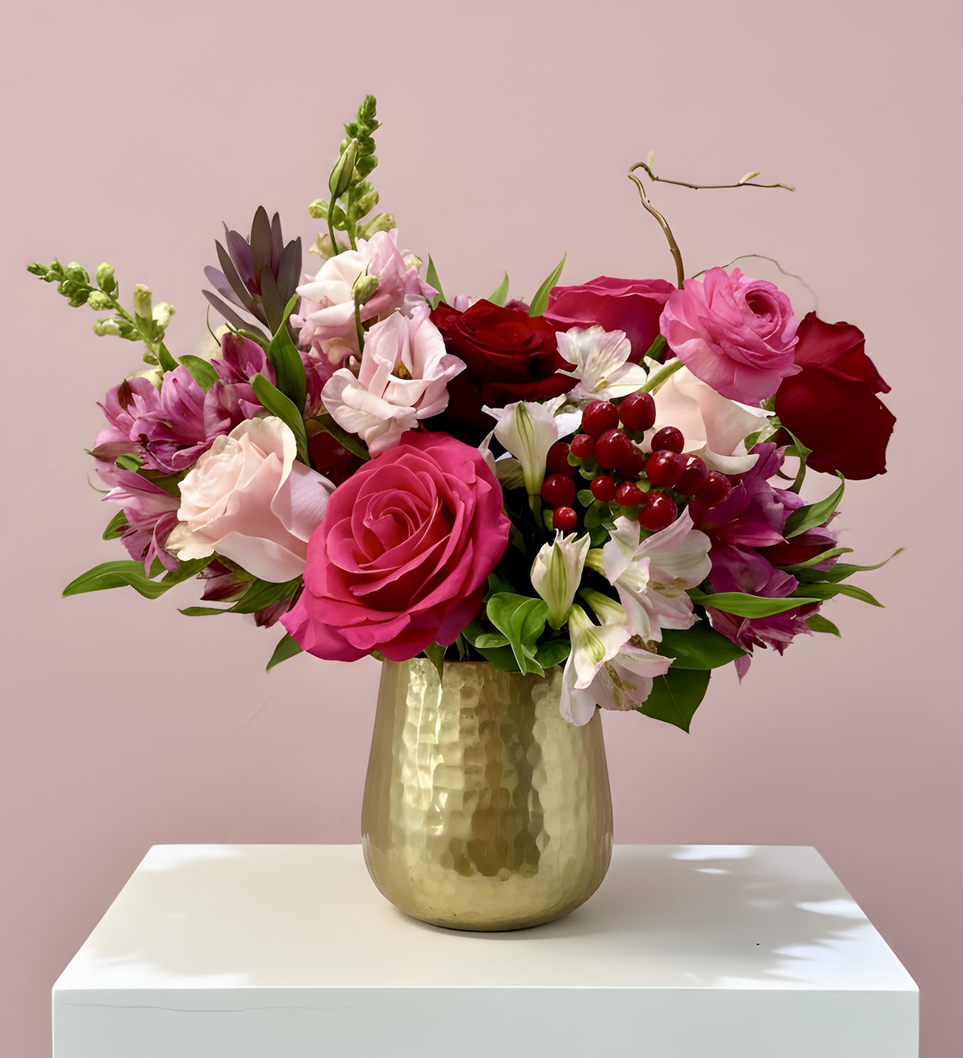 Pink Sugar - A delicious blend of hot pink, light pink, and blush blooms arranged in a radiant gold vase. Flirty, vibrant, and full of charm, this design brings sweetness and style to any celebration or heartfelt gesture.