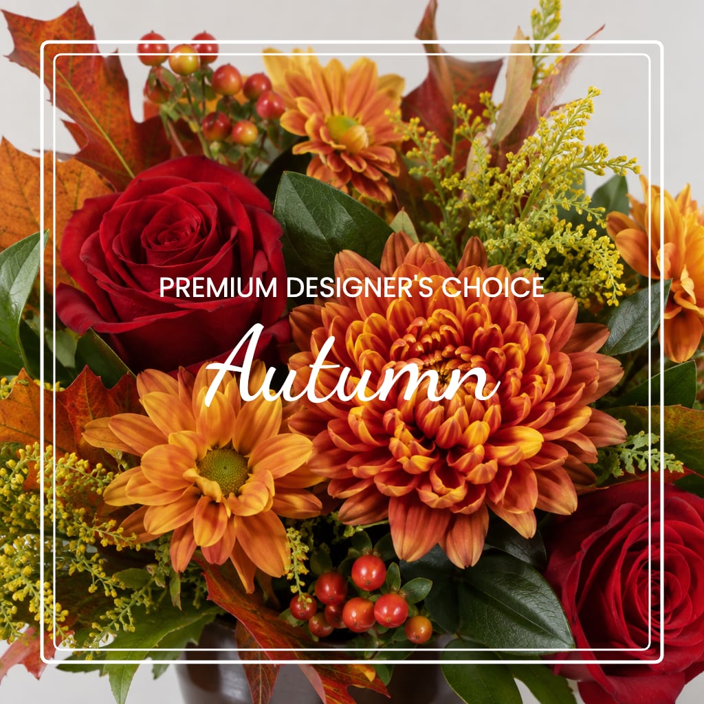Autumn bouquet with red roses and orange chrysanthemums