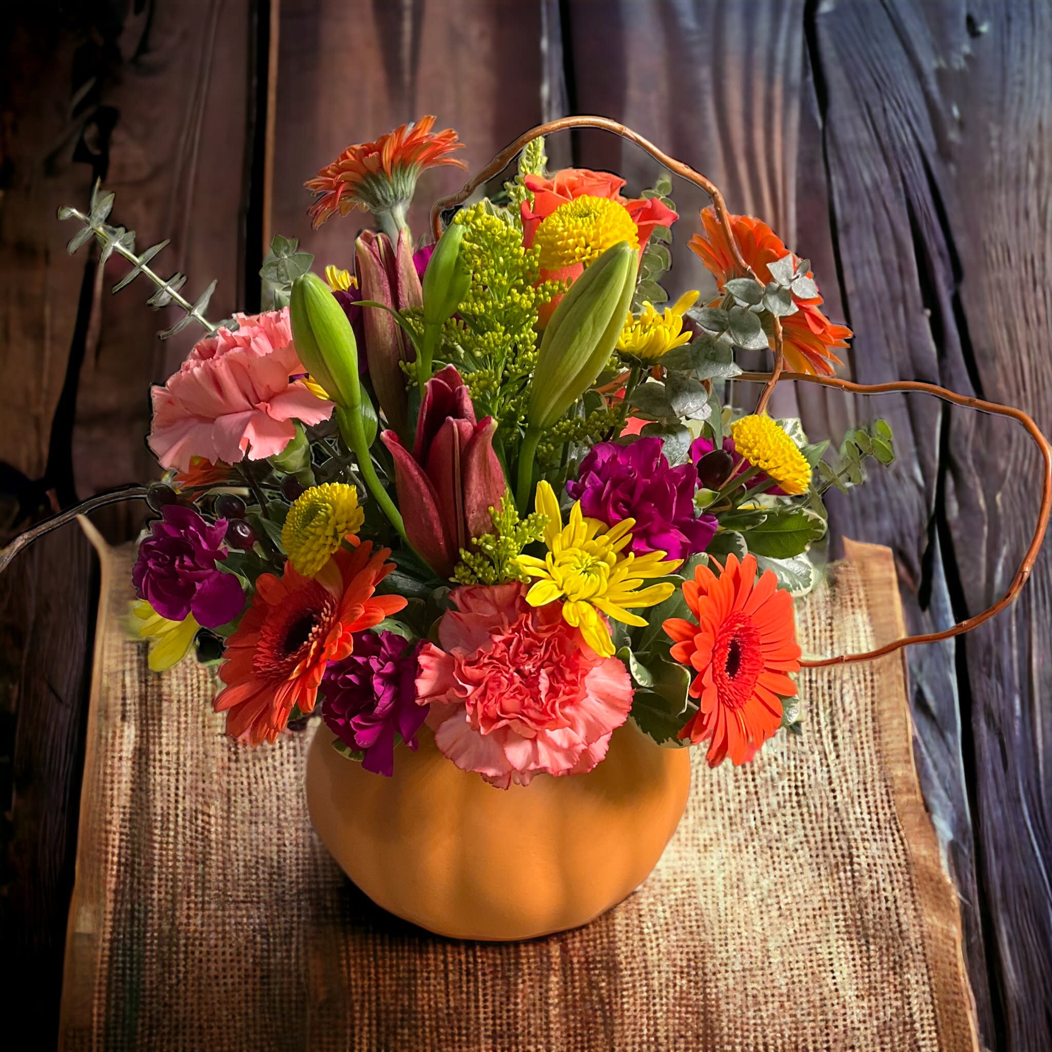 Pumpkin Spice - A cute pumpkin filled with a bounty of seasonal blooms.