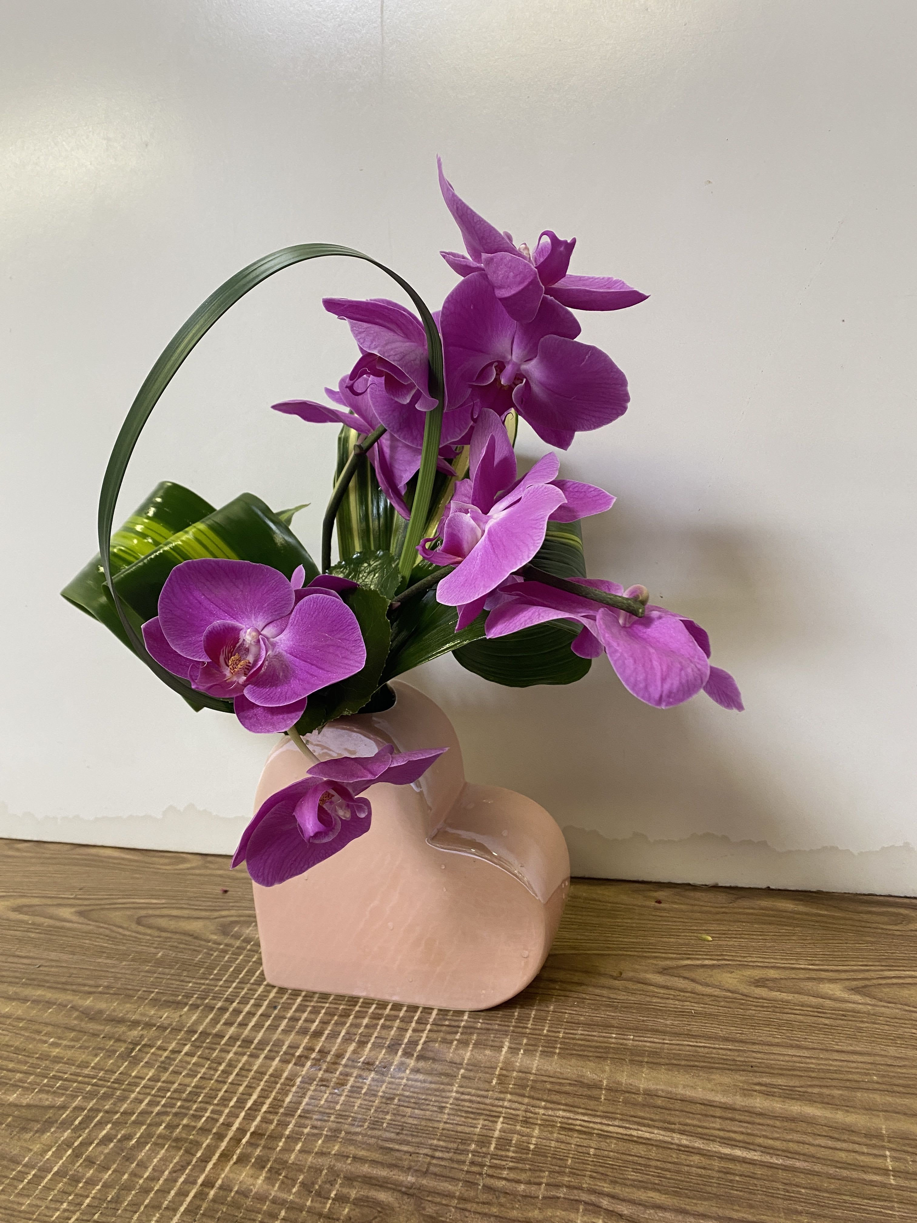 I LOVE YOU MOM - Purple phalaenopsis Orchids in the ceramic heart shape base with greenery