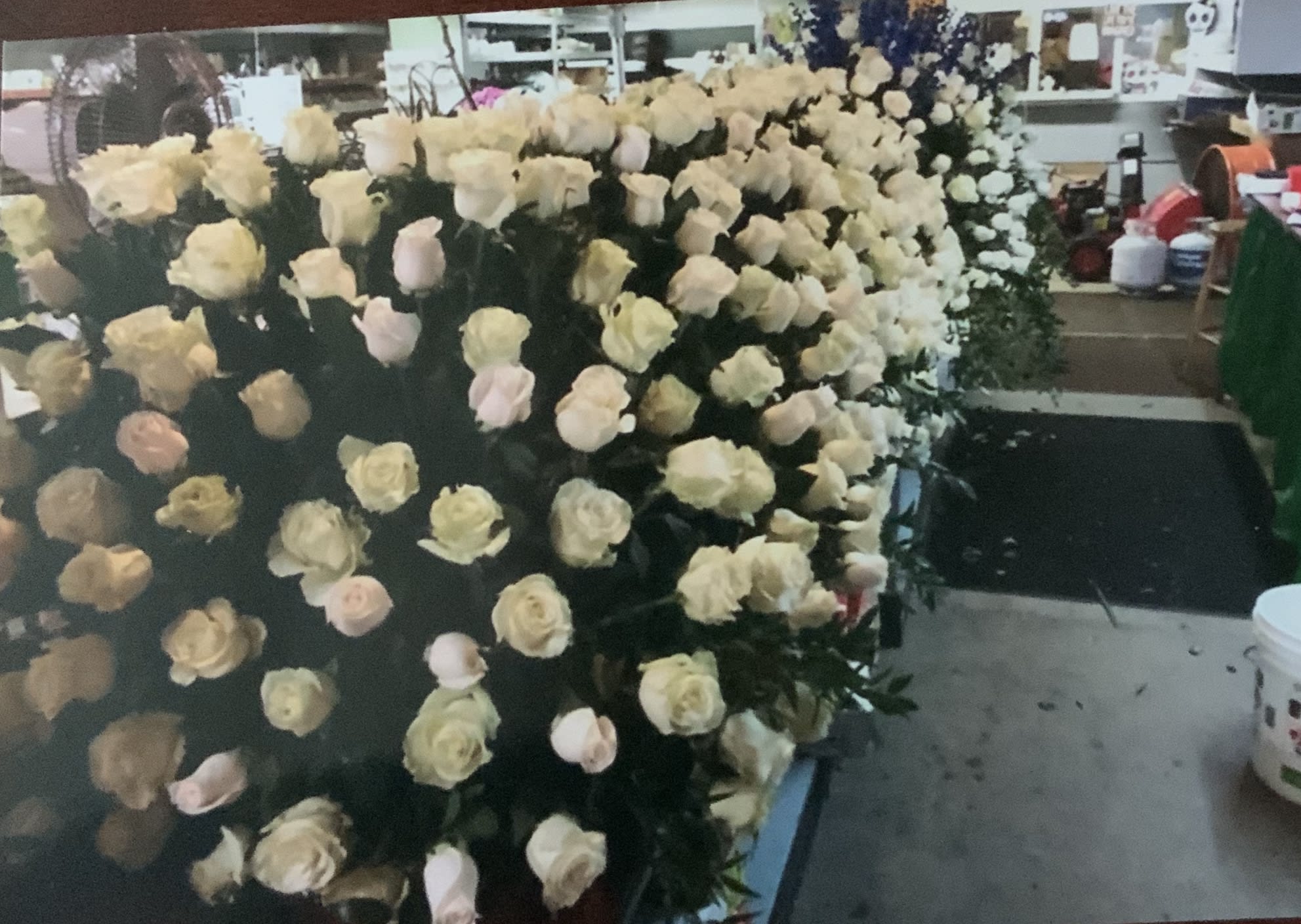Floor arrangement for front of casket - Floor arrangements are designed so people can’t walk up on the casket and its a nice design 