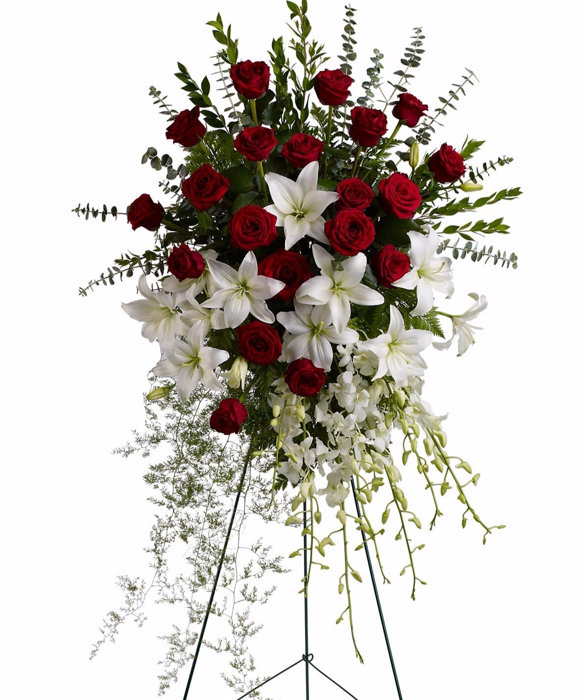 Standing spray of red roses, white lilies, and orchids on a metal easel