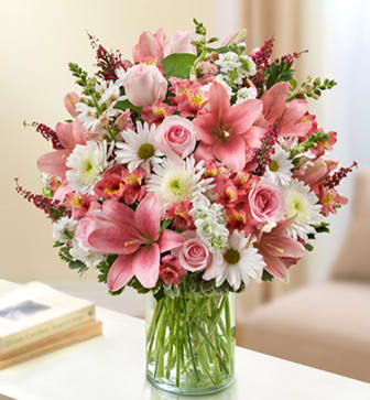 Pink and white mixed bouquet in a clear glass vase