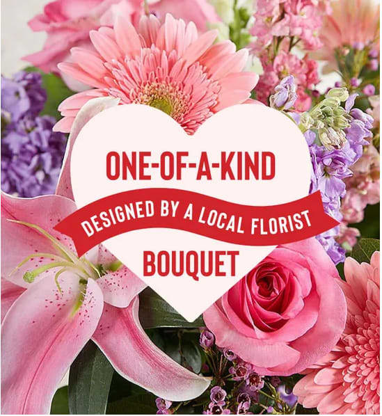 Pink and purple bouquet with a heart-shaped sign reading one-of-a-kind bouquet