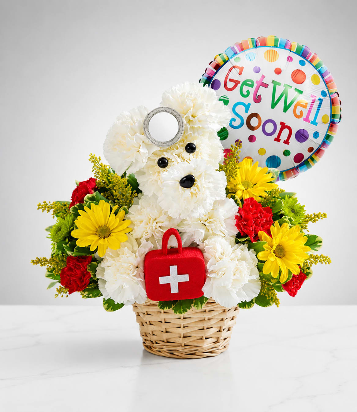 Healing Puppy - Healing Puppy is a heartwarming handcrafted floral puppy made with fresh white carnations, cheerful yellow daisies, vibrant red carnations, and lush greenery. Complete with a doctor's head mirror, a mini first aid kit, and a colorful Get Well Soon balloon, this adorable arrangement is a thoughtful way to send comfort, encouragement, and smiles to someone recovering.