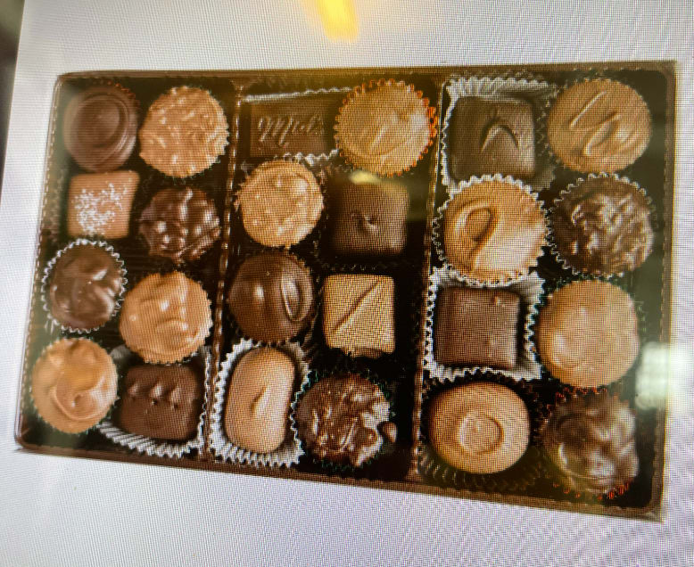 Assorted chocolates arranged in a rectangular gift box