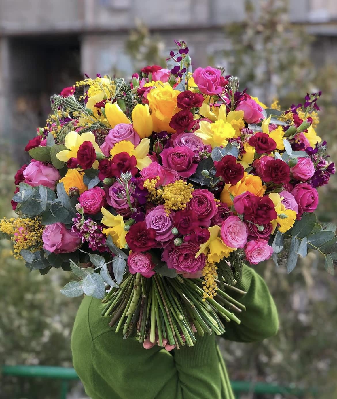 Large bouquet of pink, yellow, and burgundy flowers