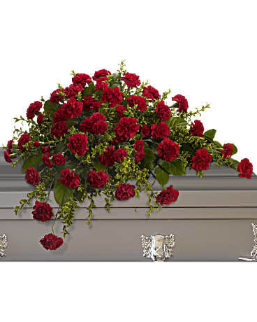 Red carnation arrangement in a gray casket