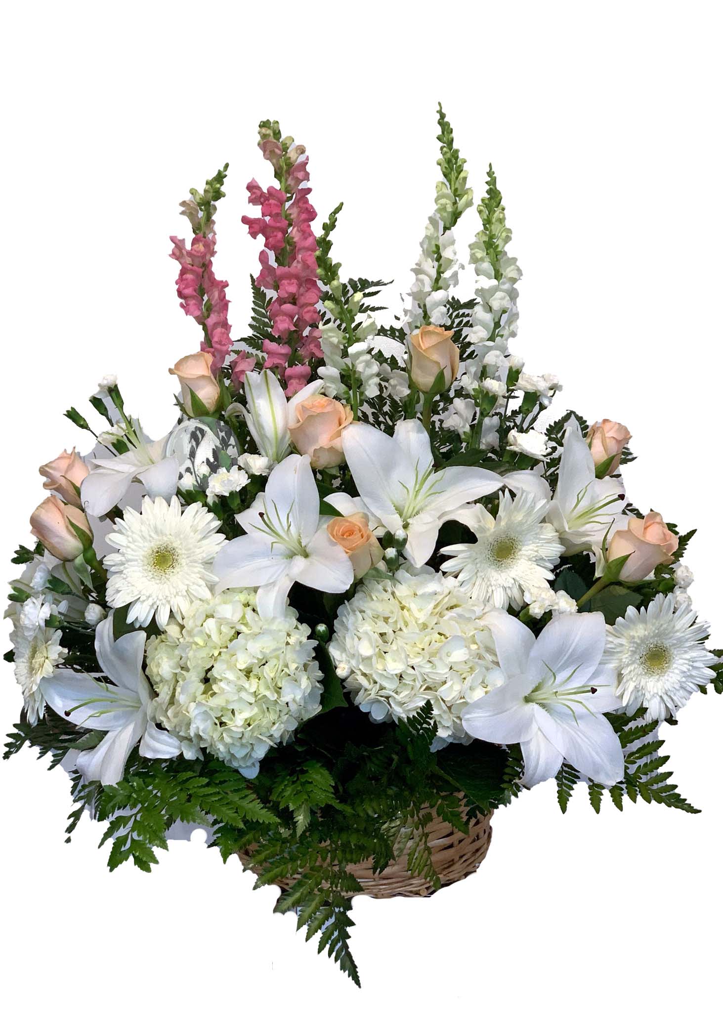 Basket arrangement of white lilies, roses, and daisies with pink snapdragons