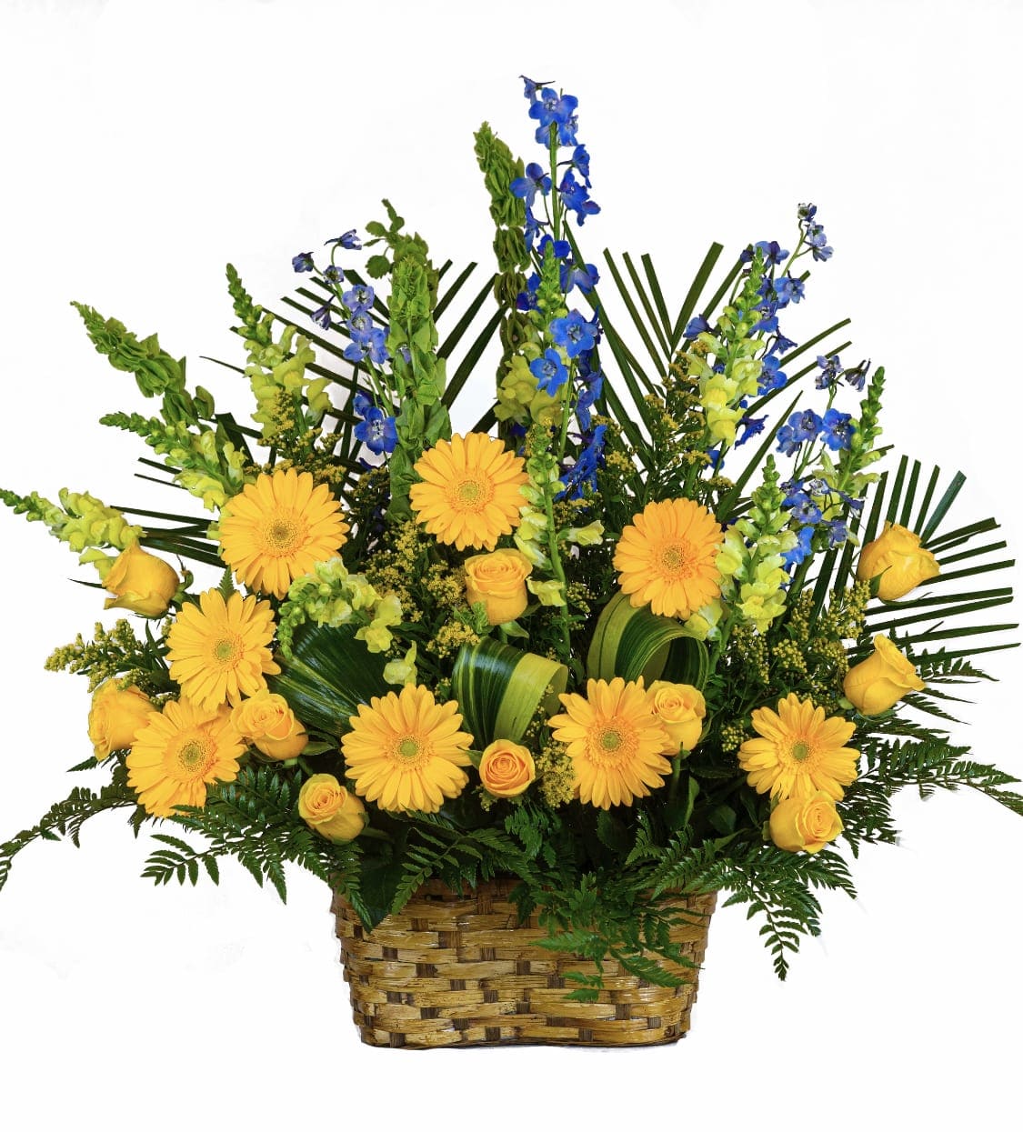 Yellow gerberas and roses with blue flowers in a woven basket