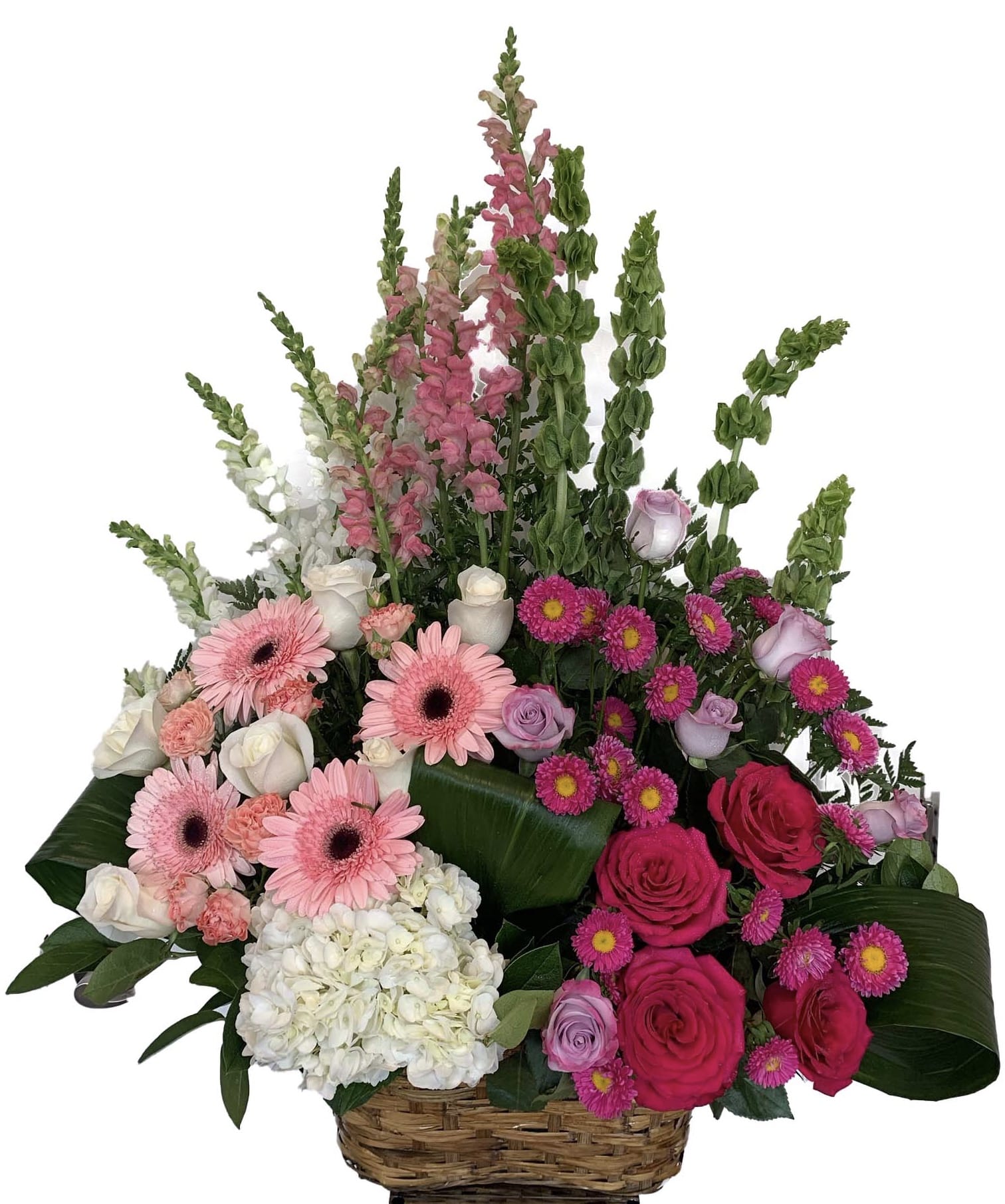 Basket arrangement with pink and white flowers, roses, gerberas, and tall snapdragons