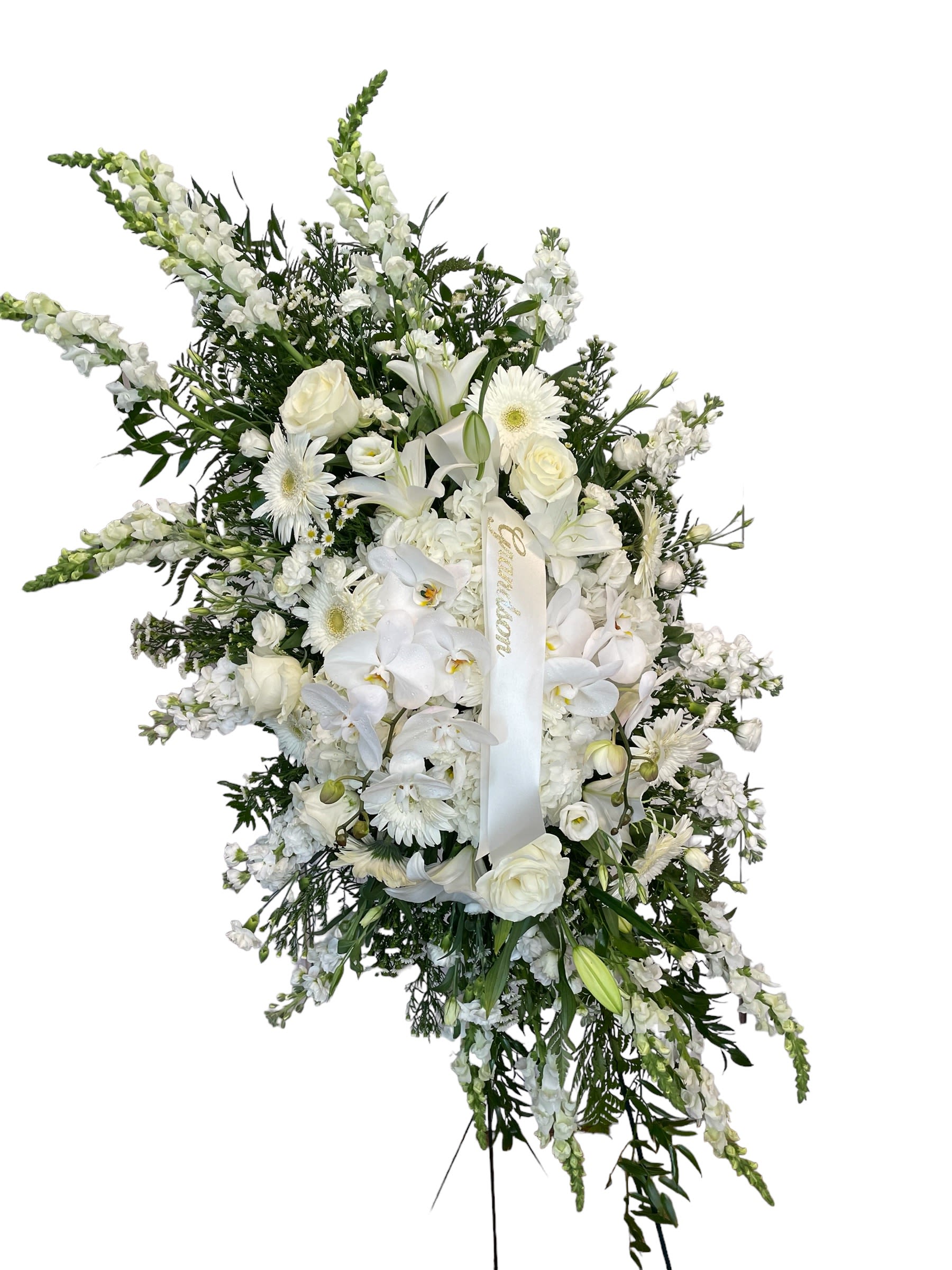White funeral spray with roses, lilies, orchids, and daisies