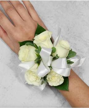 White rose wrist corsage with a satin ribbon