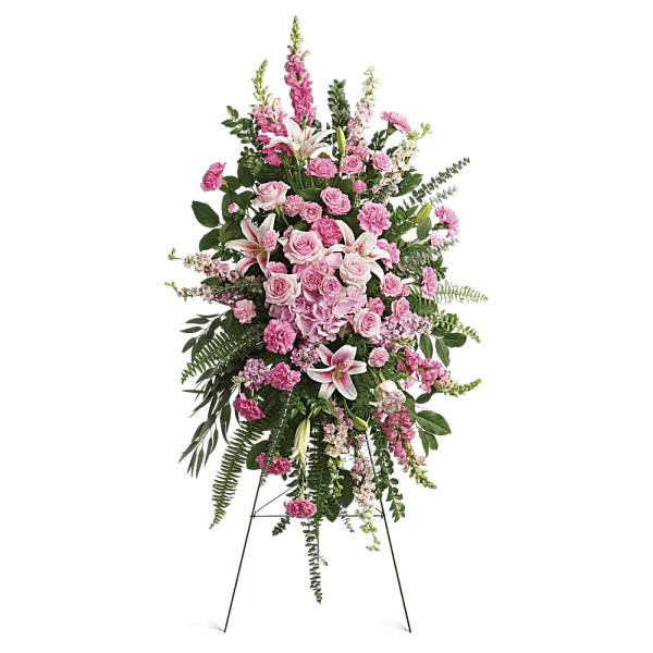 Tall pink floral standing spray on an easel