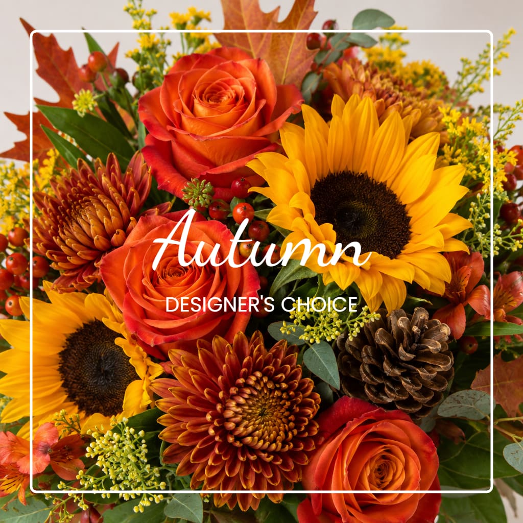 Autumn bouquet with orange roses, sunflowers, and mums