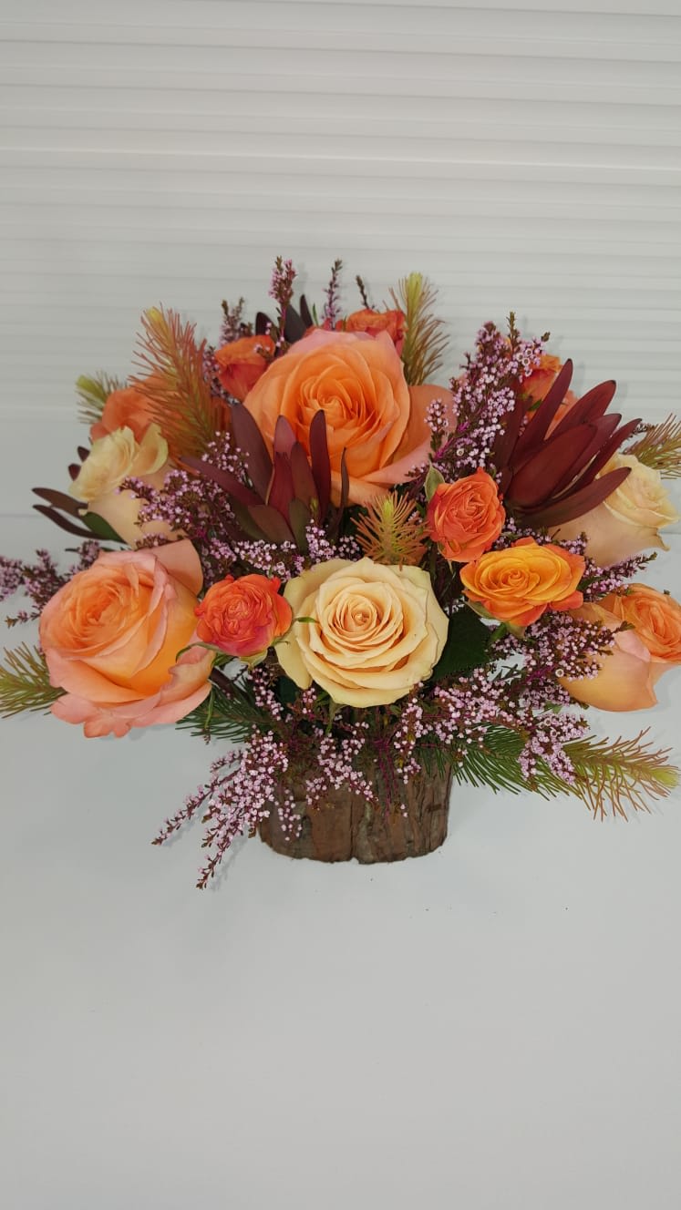 Peach Perfection  - Warm Peach toned flowers in a square wooden vase
