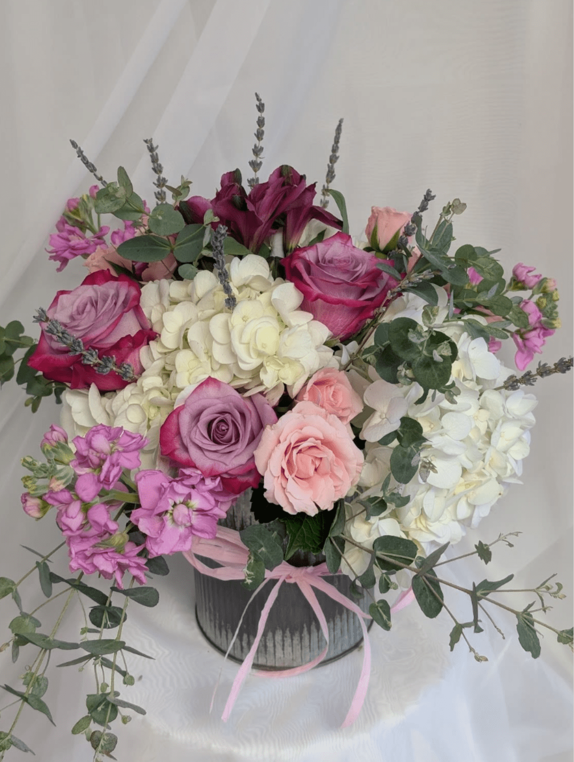 Love and Lavender - OCF - Collection of Hydrangea, Spray Roses, lavender,  in an old fashioned rustic tin can. 