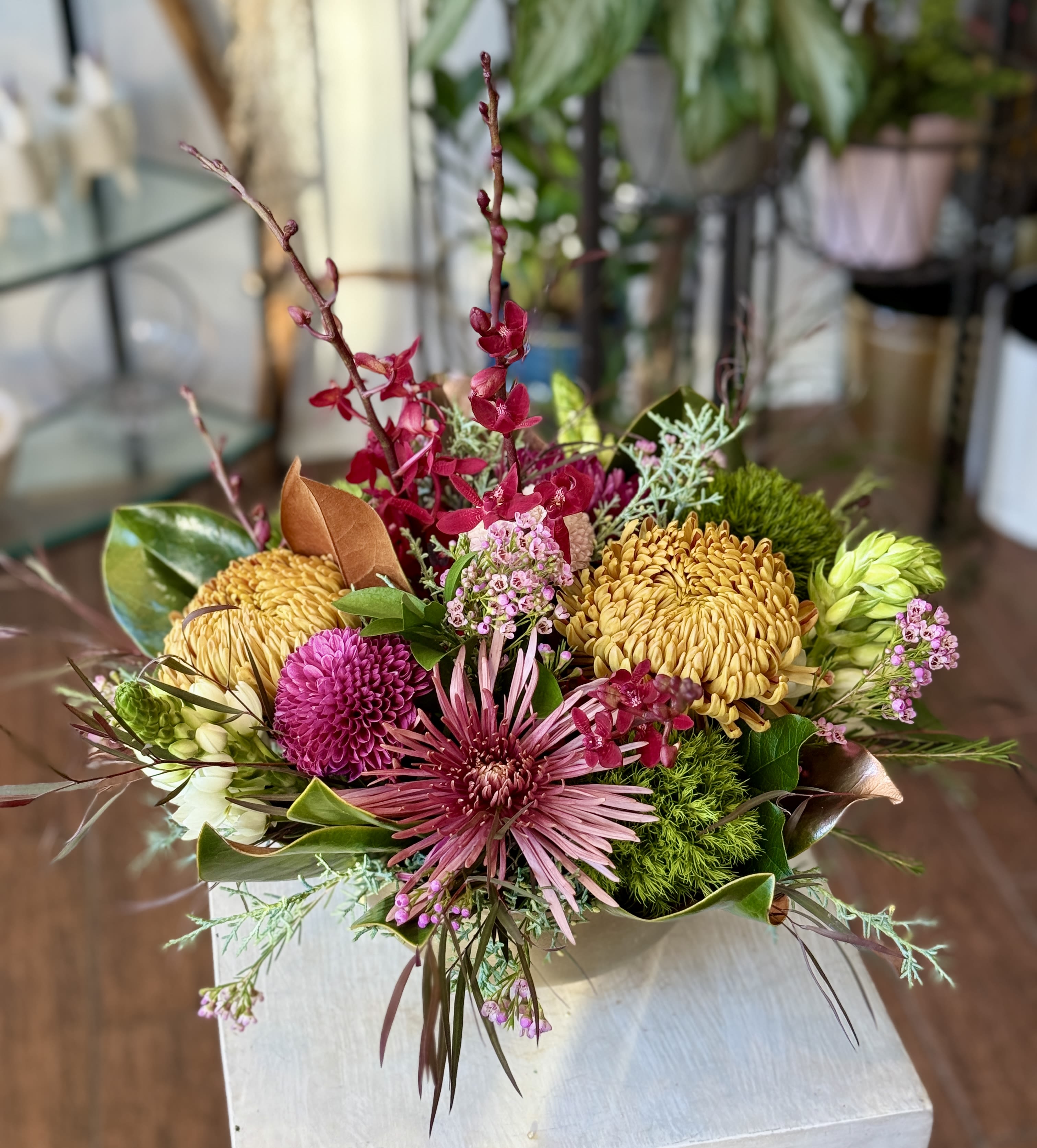 Mixed bouquet with pink and yellow blooms in a low arrangement