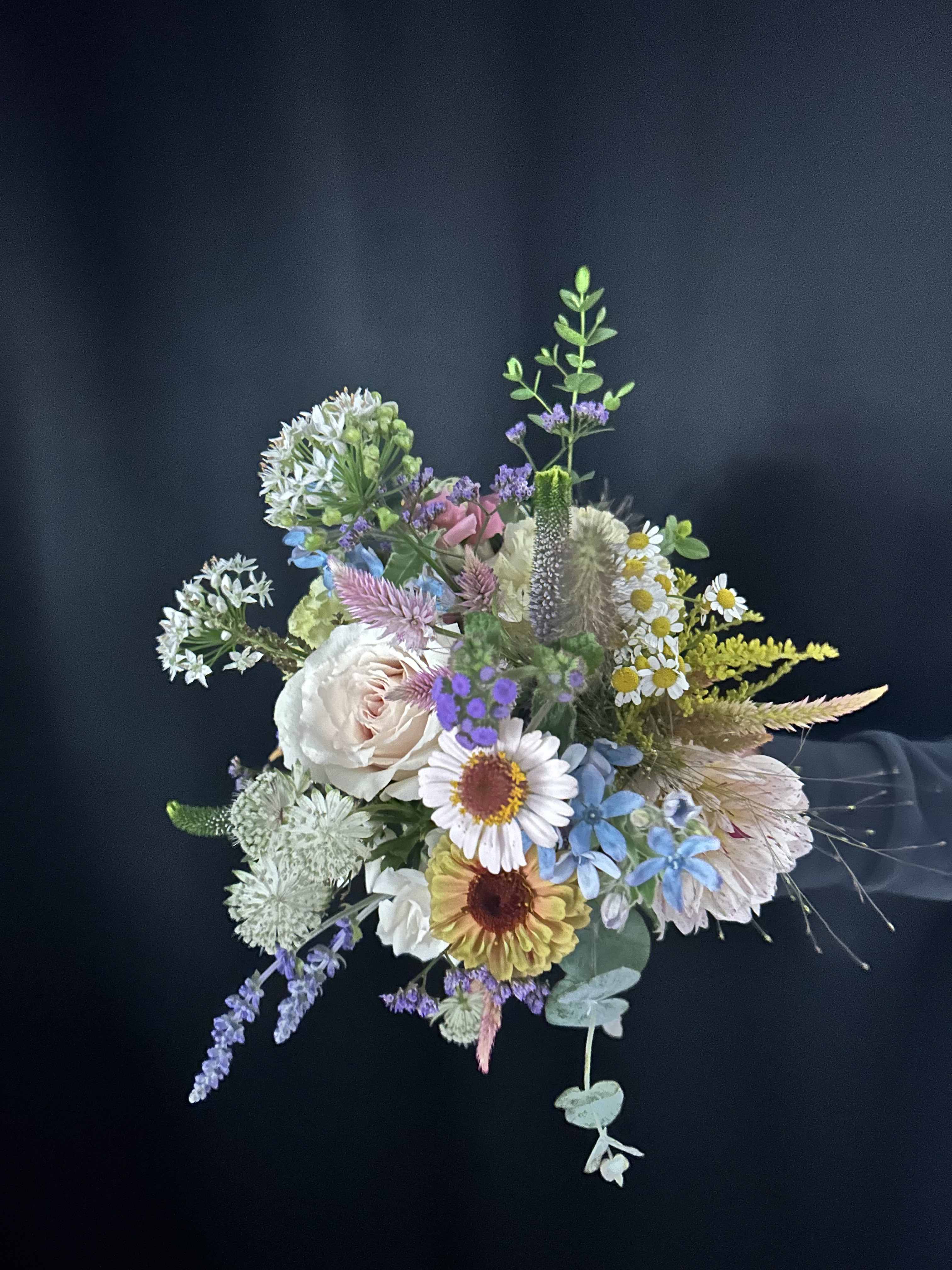 Mixed pastel bouquet with daisies, roses, and airy filler flowers