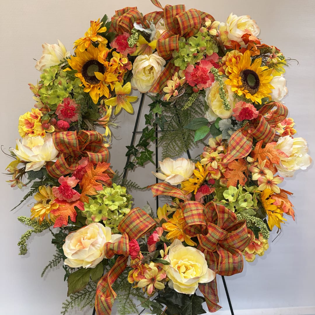 Autumn wreath with sunflowers, cream roses, and plaid bows