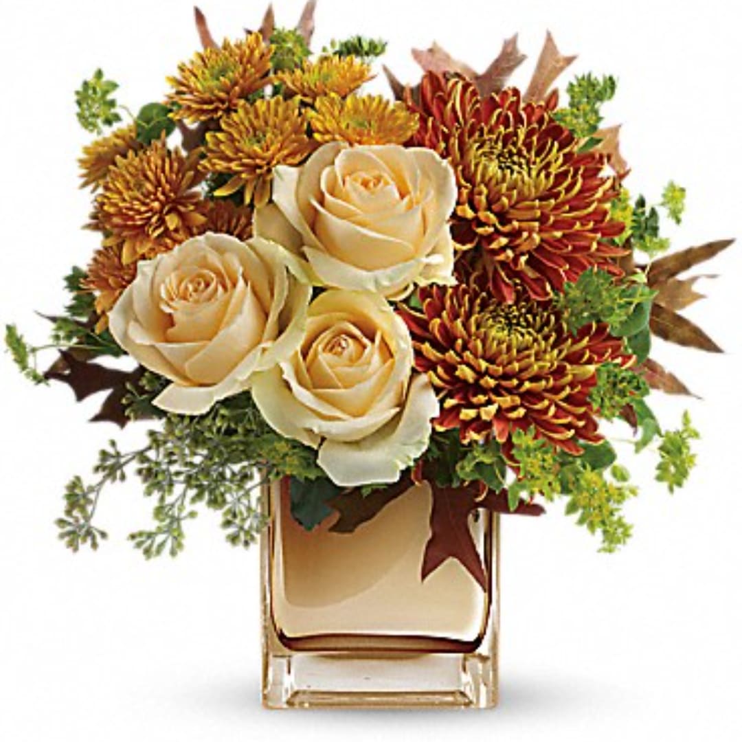 Autumn Romance - Your special someone is sure to fall in love with this fabulous fall bouquet, featuring lush roses and warm autumn blooms in a sparkling mirrored glass cube.