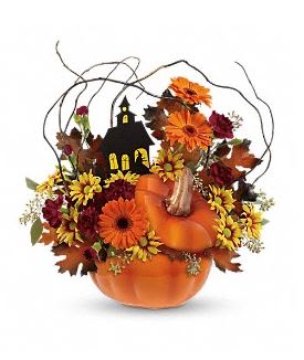 Pumpkin-shaped floral arrangement with orange and yellow flowers