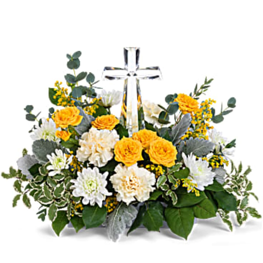 Yellow and white flower arrangement with a clear cross centerpiece