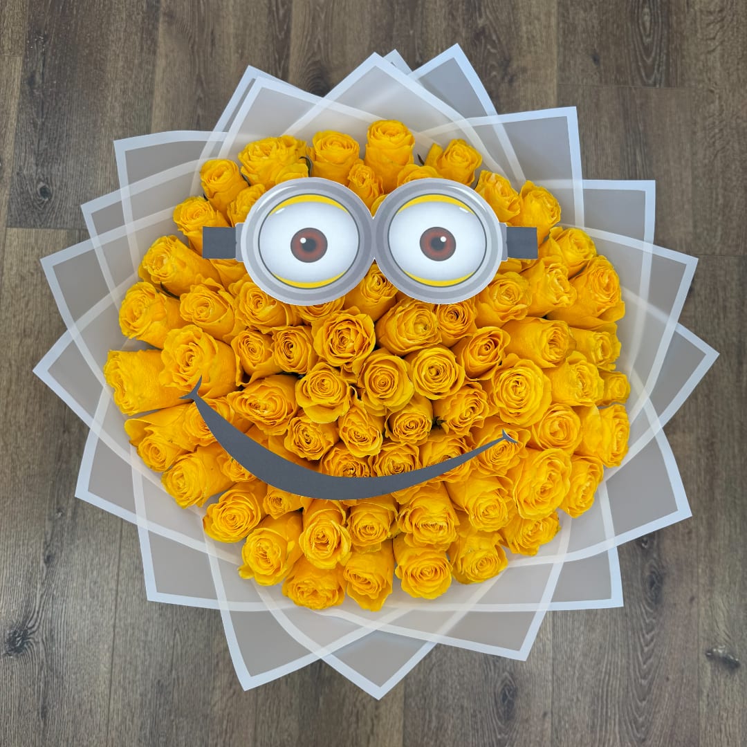 Yellow rose bouquet with a cartoon face and clear wrap