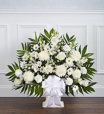 Heartfelt Tribute White Floor Basket Arrangement - Product ID: 91212   Crafted from striking white blooms, our tasteful floor basket arrangement is a beautiful symbol of your care and concern in this time of sorrow. Hand-gathered with the freshest roses, mums, snapdragons and more, itâs a beautiful expression of all the love in your heart as well as a touching way to remember a loved one who has passed. Floor basket arrangement of fresh white flowers Medium and large arrangements include white roses, snapdragons, spider mums and more Small arrangement includes spider mums, snapdragons, carnations and more Appropriate for family, friends or business associates to send directly to the funeral home Our florists use only the freshest flowers available, so colors and varieties may vary Large arrangement measures approximately 32"H x 40"L Medium arrangement measures approximately 32"H x 38"L Small arrangement measures approximately 32"H x 32"L