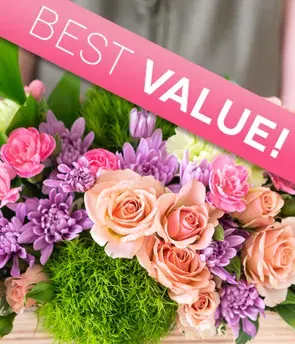 Pink and peach roses with purple flowers and a BEST VALUE ribbon