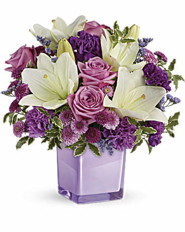 Pleasing lavender Bouquet - This arrangement make with lavender flowers like roses , daisy , carnations and white lilies in a lavender cube.
