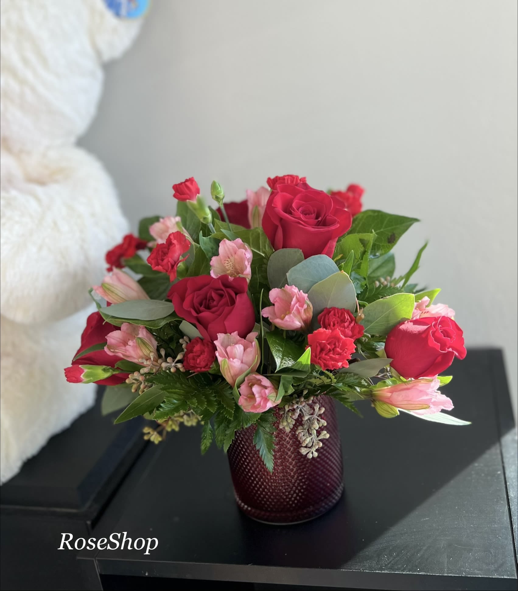 Radiant Love - Romantic Red Rose bouquet looks ravishing inside a pearlescent scarlet vase with embossed diamond pattern.
